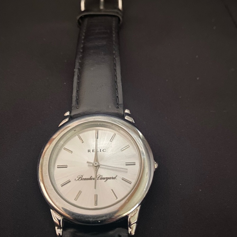 Relic stainless steel watch with black leather band.